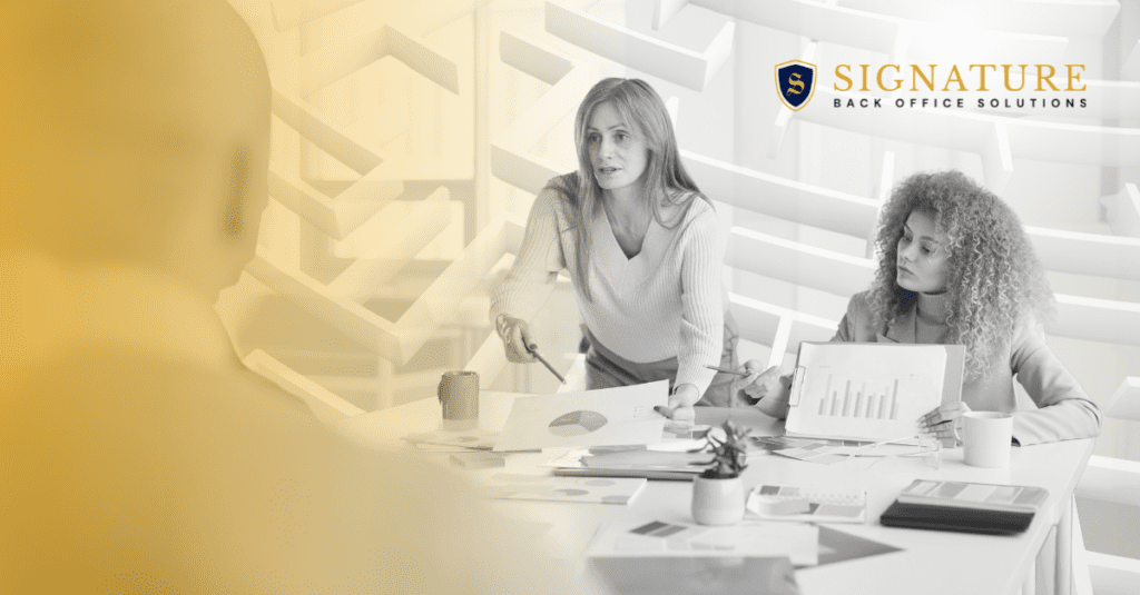 A group of people sitting around a table.