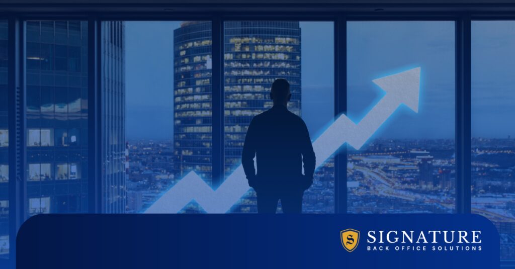 A man standing in front of a window with an arrow pointed upwards illustrating the impact of EOR services on staffing and employer benefits.