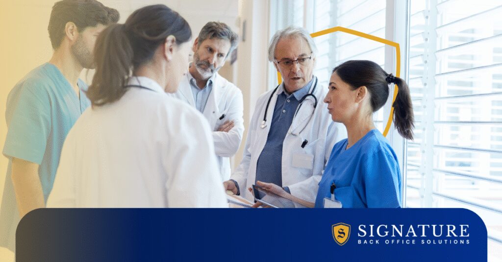 A team of healthcare professionals in a hospital setting collaborates on healthcare staffing solutions.