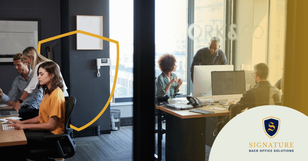 Executive search firm team working in modern office highlighting the need for robust back-office support when scaling into contract staffing services