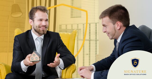 Professional holding miniature house during consultation on staffing insurance requirements.