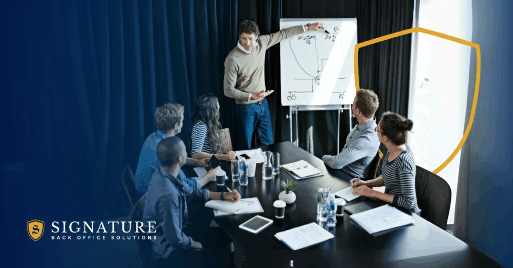 Business executive pointing at upward growth chart with protective shield representing EOR versus factoring decision.