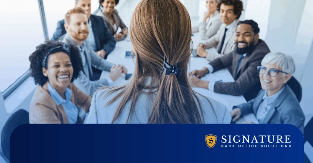 Staffing executive discussing hiring surge 2026 opportunities with leadership team in strategy meeting.