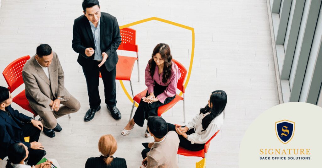 Staffing agency team meeting to review compliance updates 2026 requirements and regulations.