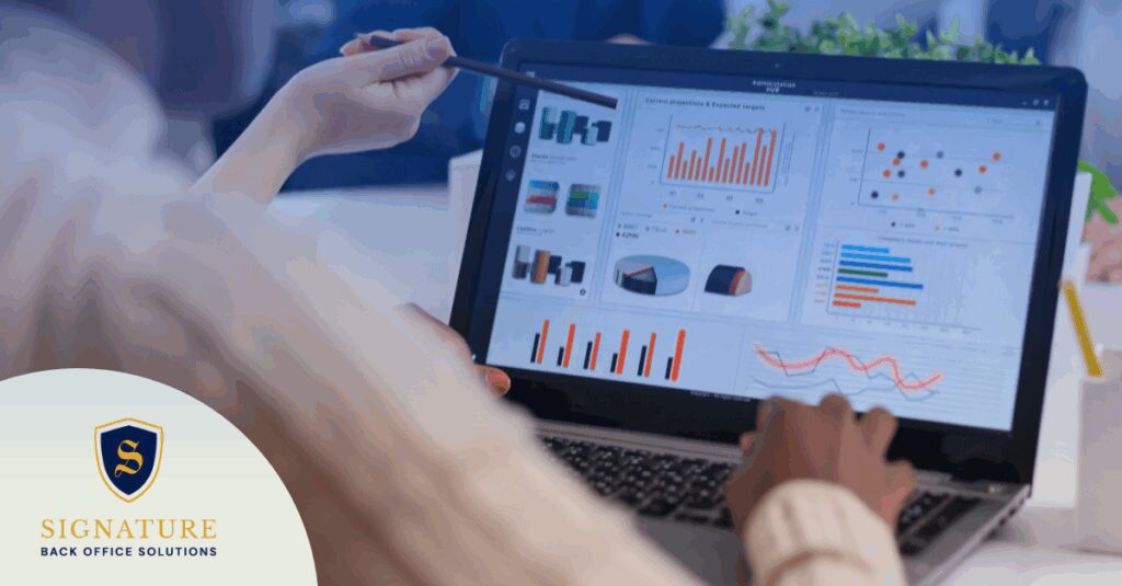 Team reviewing contract hiring tech 2026 analytics dashboard on laptop during strategy meeting.