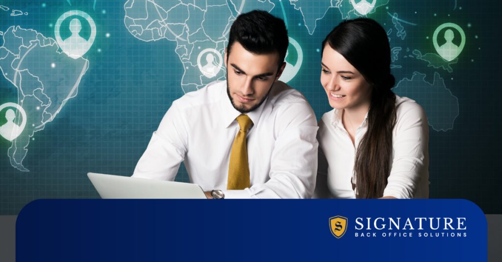 Staffing professionals reviewing staffing tech automation 2026 tools on laptop with global workforce map