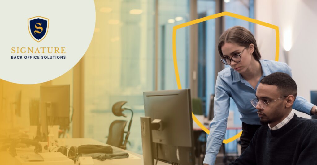 Professionals collaborating at computer reflecting temp job seeker expectations 2026 for workplace quality.