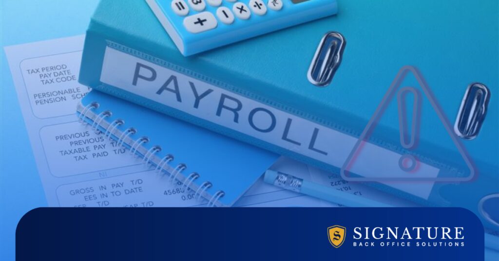 Close-up of payroll records and calculator representing contractor payroll management and risk prevention.