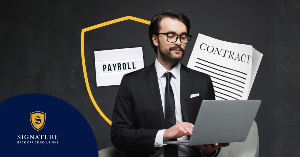 Suited professional reviewing a contract and laptop beside payroll sign illustrating contractor payroll trust.